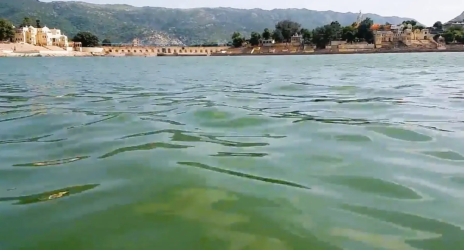 Pushkar Lake with waterfront ghats and Aravalli hills in the background
