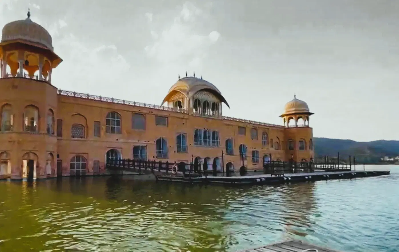 Jal Mahal palace reflected in Man Sagar Lake on the Jaipur-Amber Road at dusk