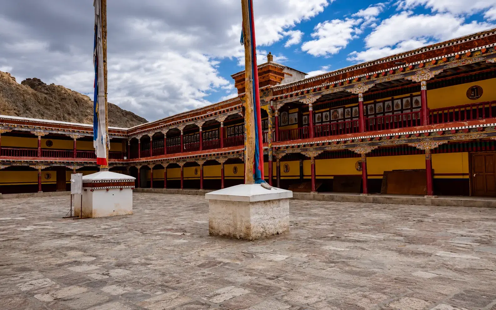 Hemis Monastery's courtyard decorated for the Hemis Festival with monks in masks — Ladakh's grandest Buddhist celebration