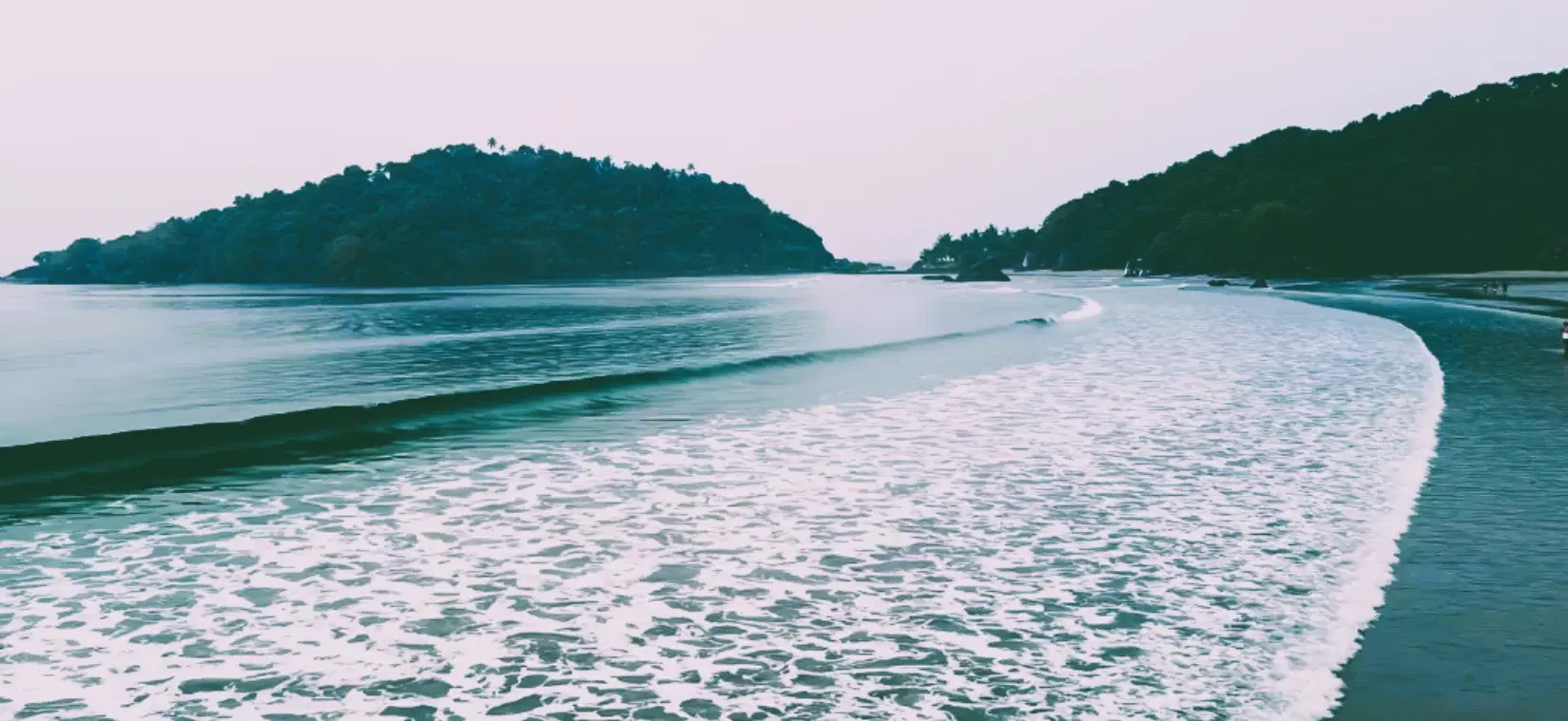 Palolem Beach bay and forested headlands in South Goa
