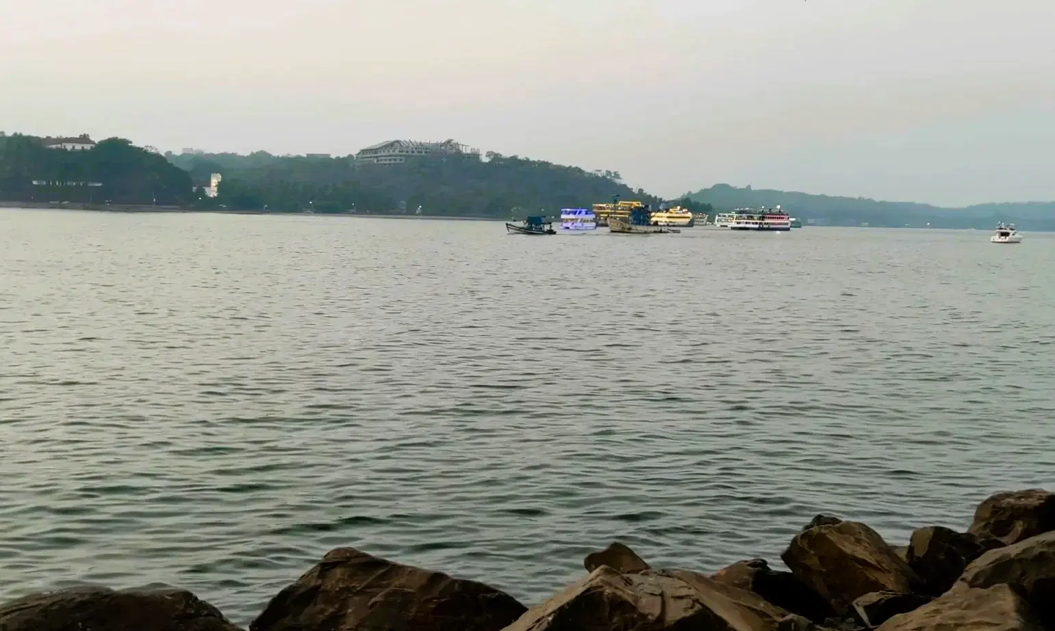 Mandovi River waterfront and boats beside Panaji