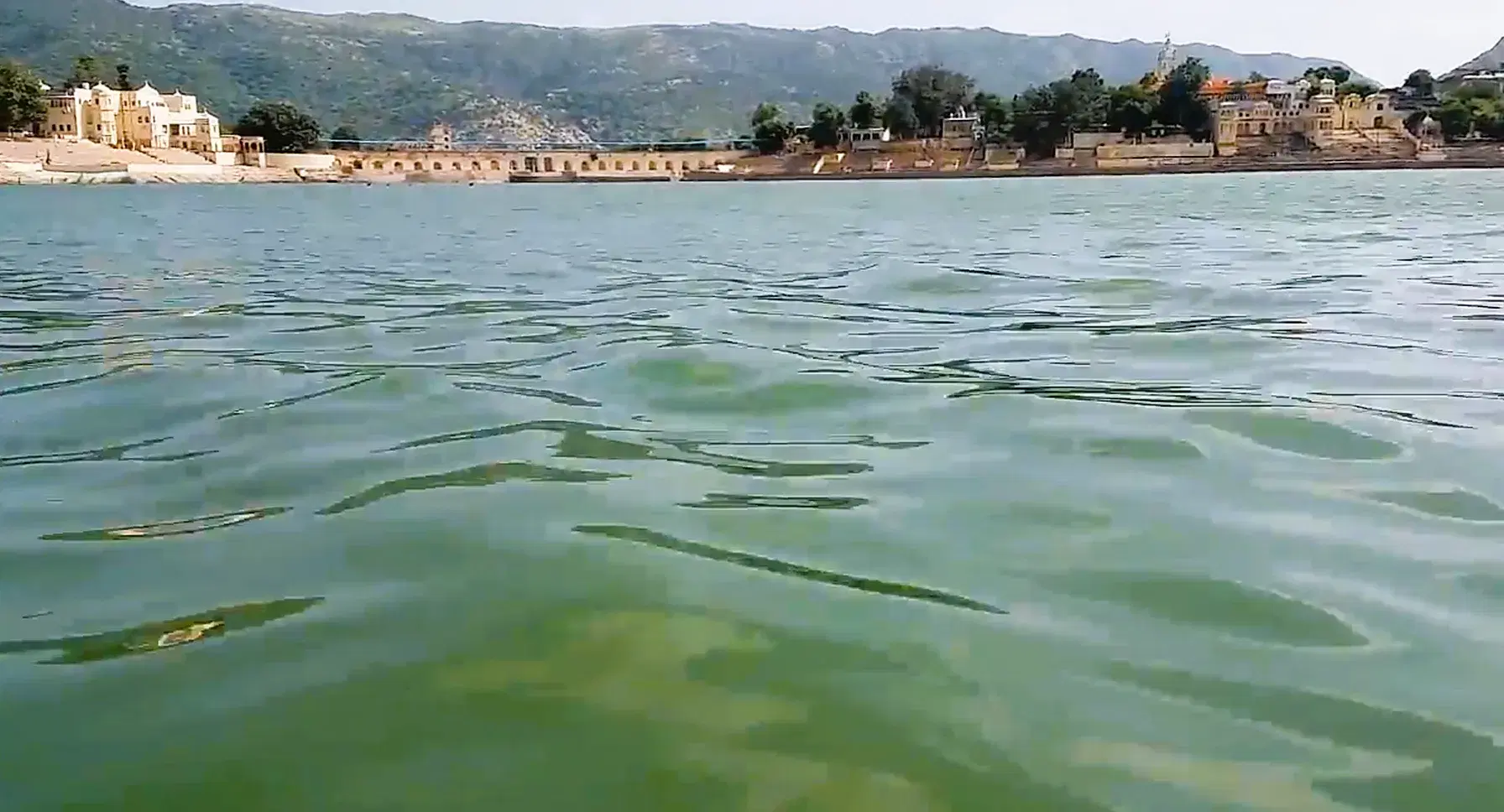 Pushkar Lake with waterfront ghats and Aravalli hills in the background