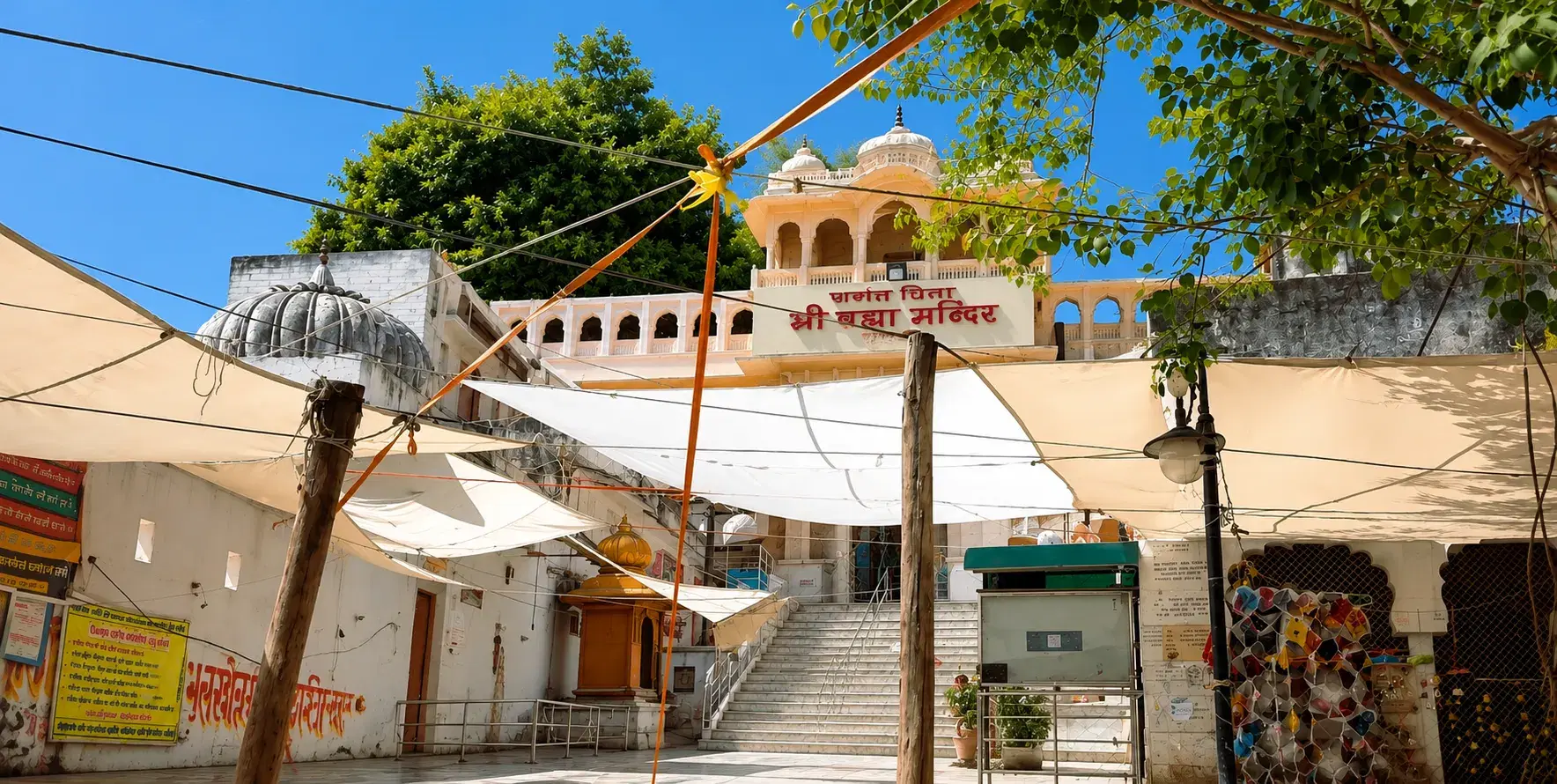 White facade and entrance steps of Jagatpita Brahma Temple in Pushkar