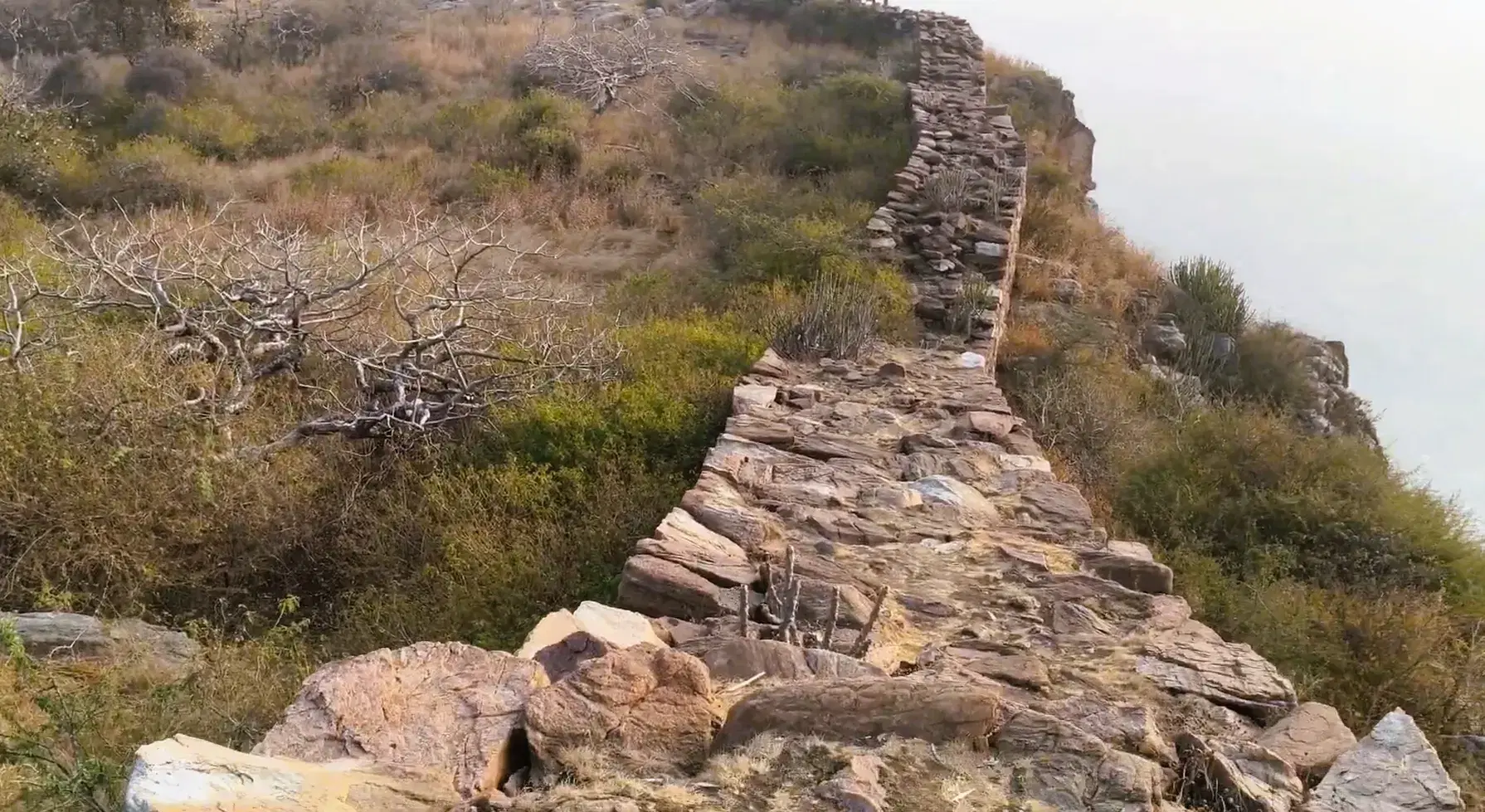 Rocky ridge path and old stone wall on Nag Pahad near Pushkar