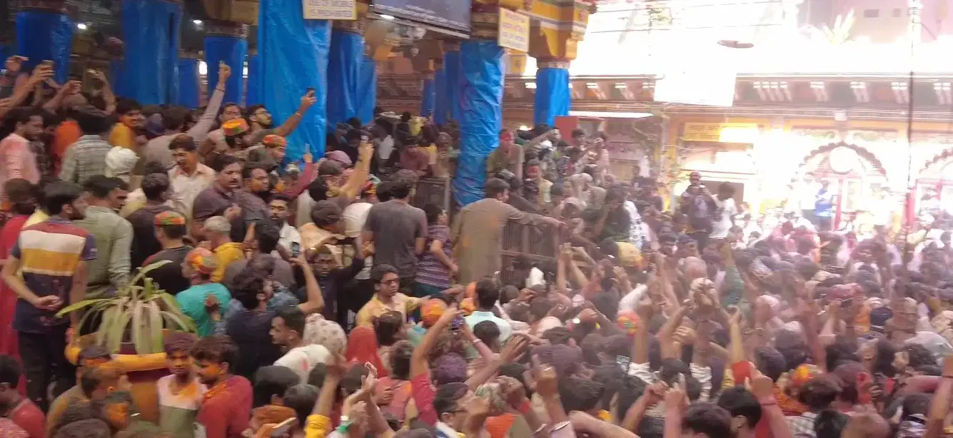 Devotees celebrating Holi with vibrant colours in Vrindavan