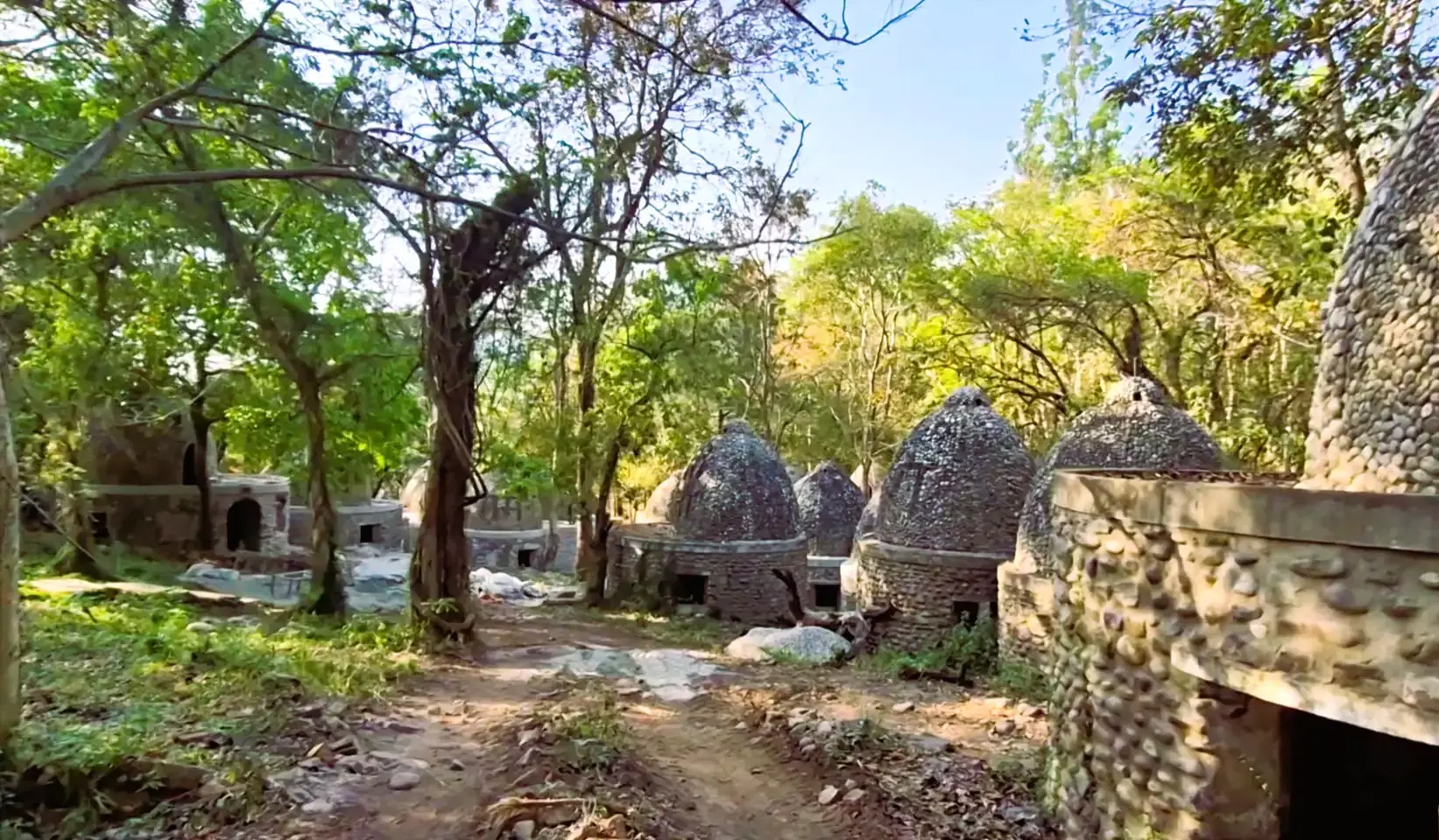 Colourful Beatles-inspired street art covering the ruined meditation huts inside Chaurasi Kutiya Ashram, Rishikesh