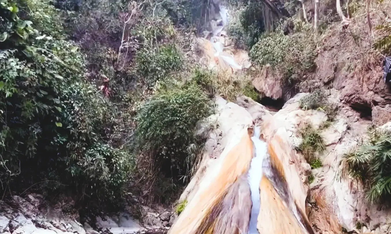 Neer Garh Waterfall cascading through dense jungle, 8 km from Rishikesh on the Laxman Jhula road