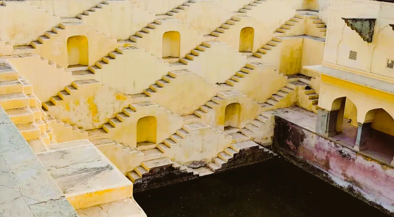 Symmetrical V-shaped zigzag stairs of Panna Meena Ka Kund stepwell near Amber Fort, Jaipur
