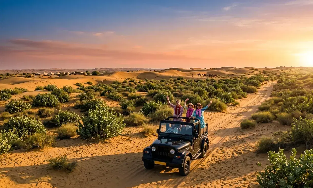 Camel caravan crossing Sam Sand Dunes near Jaisalmer at sunset