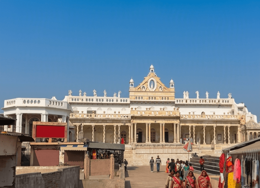 Sri Rangji Temple's South Indian gopuram and Pagal Baba Temple's multi-story tower in Vrindavan