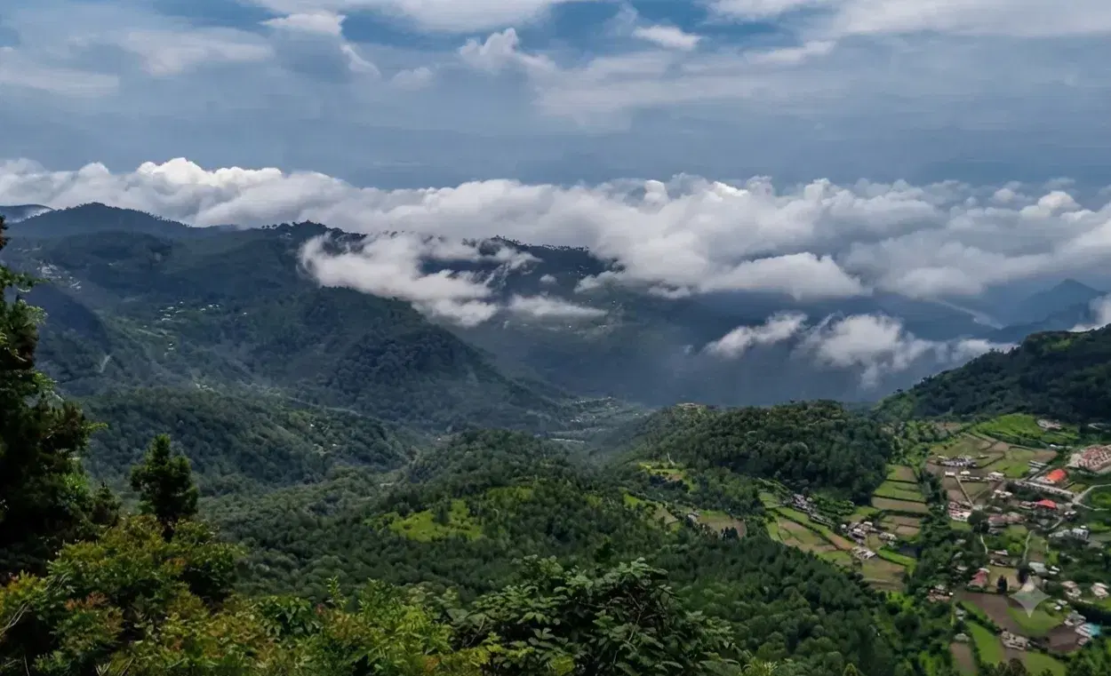 High rocky cliffs at Land's End viewpoint overlooking Khurpatal Lake and the Kumaon hills near Nainital
