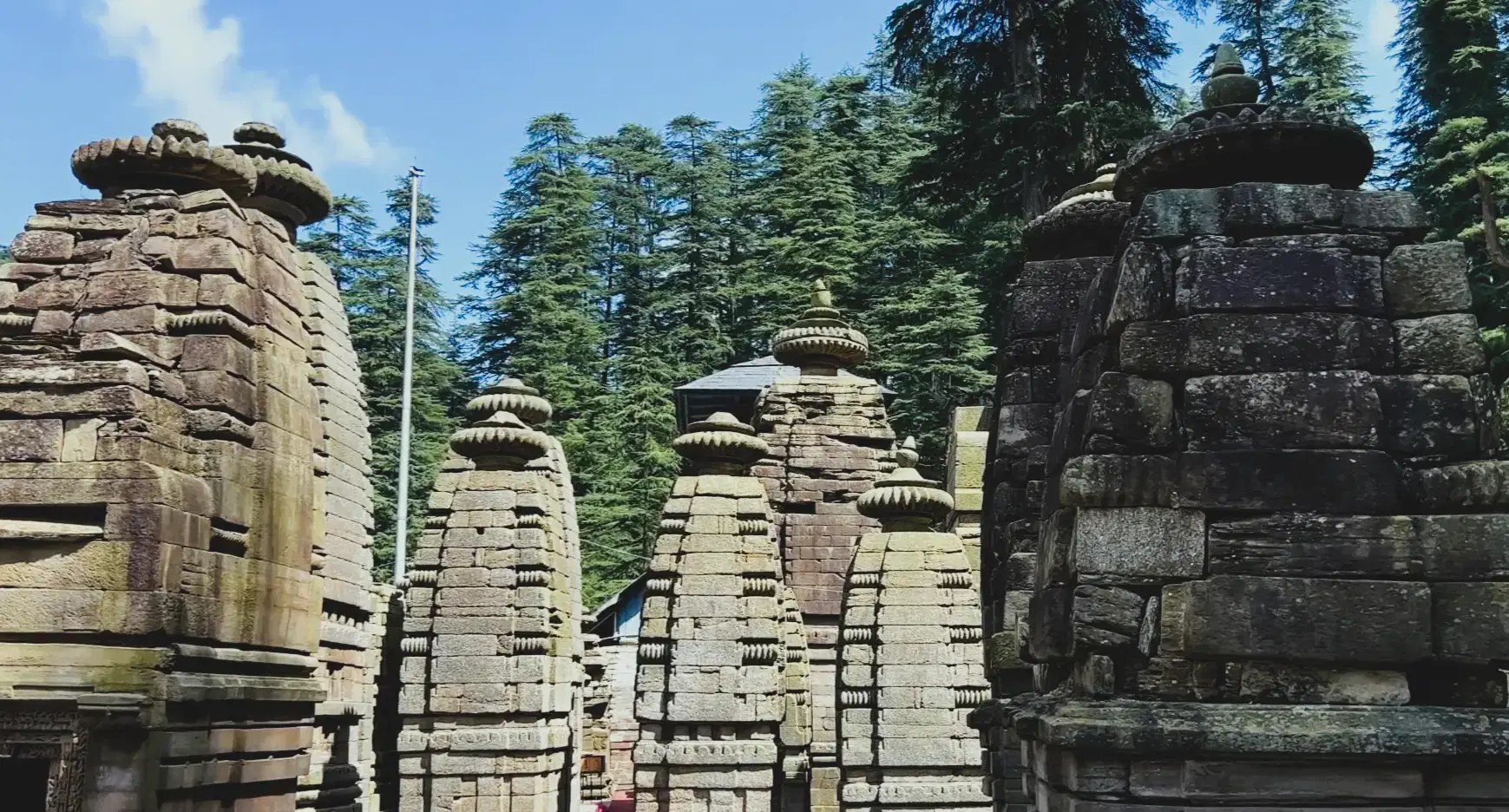 Ancient stone shrines at Jageshwar Dham surrounded by deodar forest