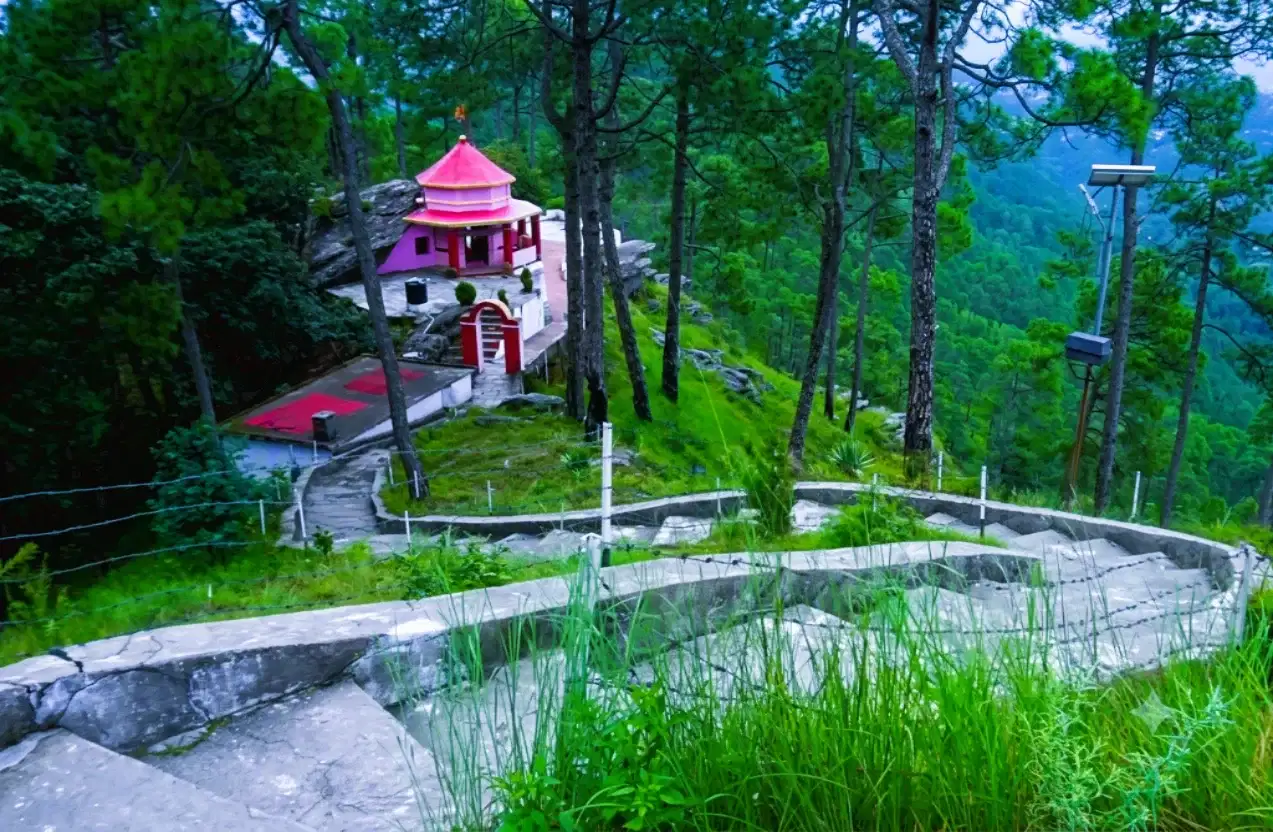 Track leading towards Kasar Devi Temple with a view of the Almora hills