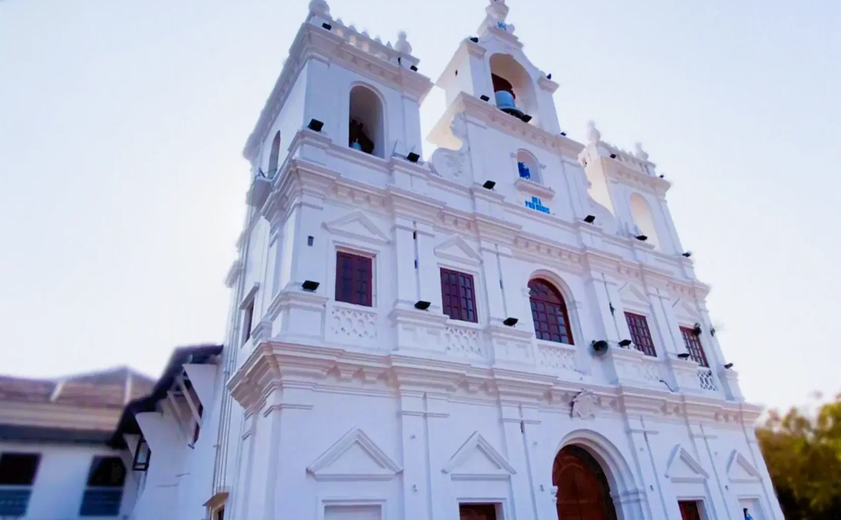White facade and symmetrical stairway of Our Lady of the Immaculate Conception Church in Panaji