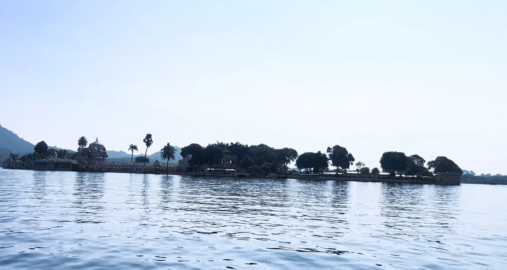 Lake Pichola with an island temple and Udaipur waterfront
