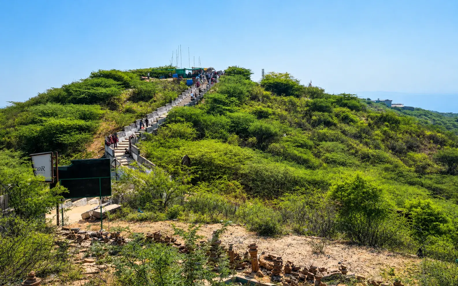 Steps crossing the green hillside at Kalo Dungar in Kutch