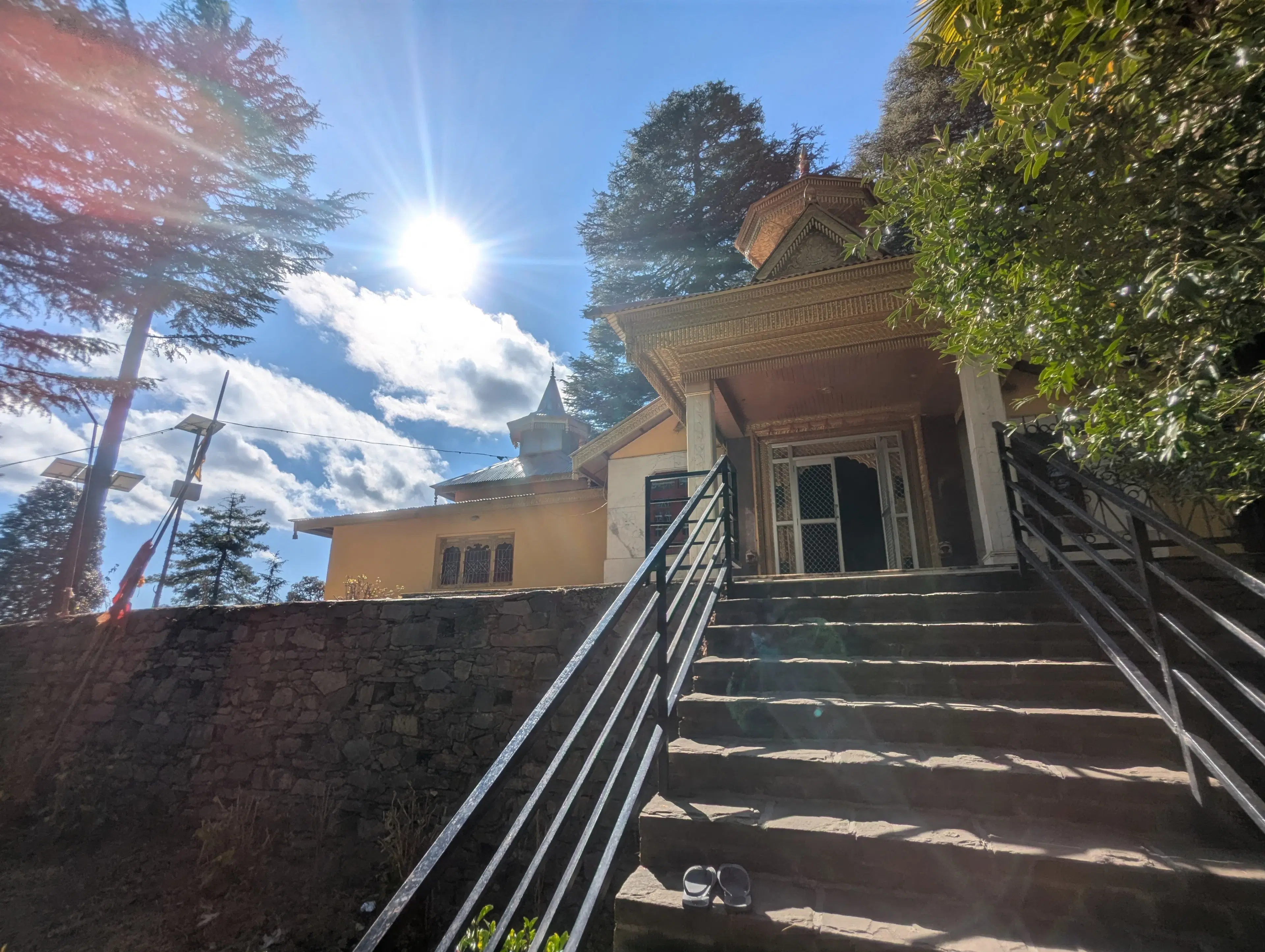 Sunlit entrance steps of Talai Mata Temple in Mashobra near Shimla
