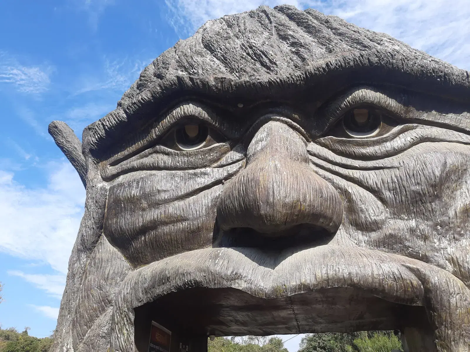 Sculpted face entrance at Robber's Cave in Gucchupani, Dehradun