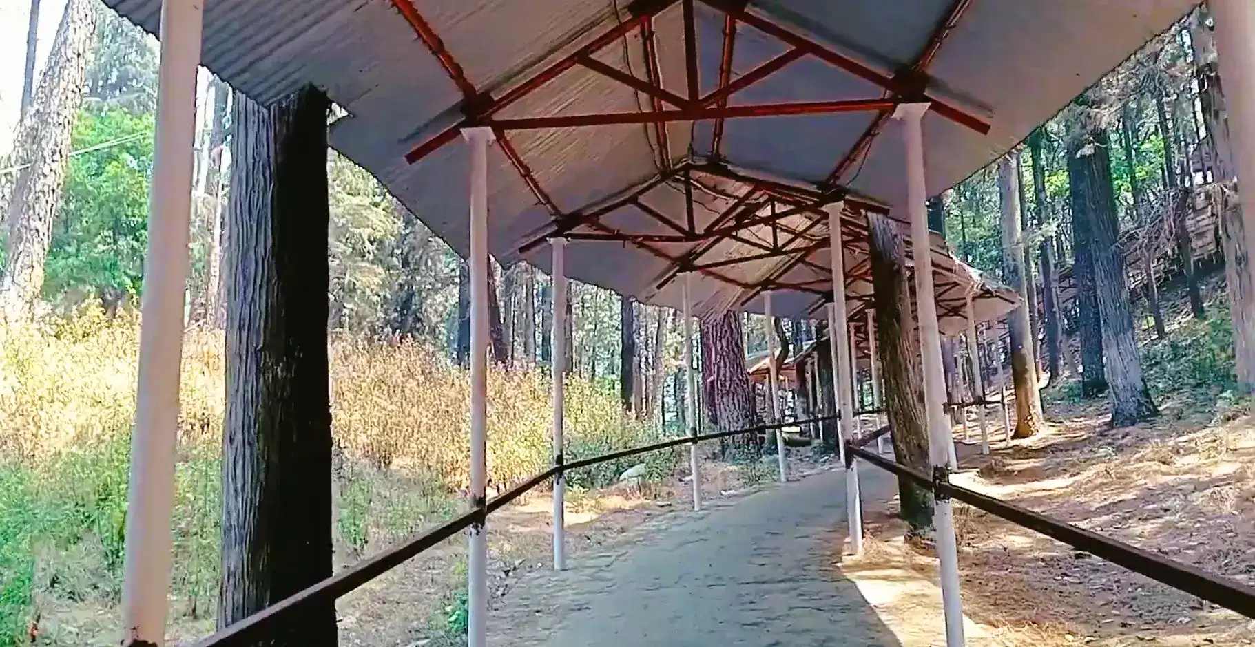 Kandoliya Temple on a forested ridge above Pauri town
